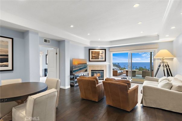 Dining room, Fireplace, Interior, Living room, Recessed Lighting, Water, Wood Texture Flooring