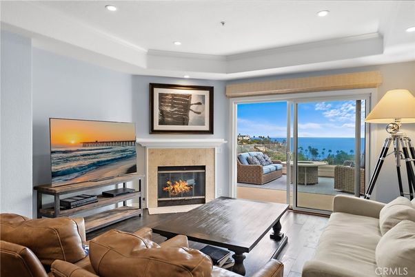 Fireplace, Interior, Living room, Recessed Lighting, Water, Wood Texture Flooring
