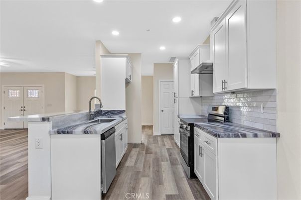 Interior, Kitchen, Recessed Lighting, Stainless Steel Appliances, Wood Texture Flooring