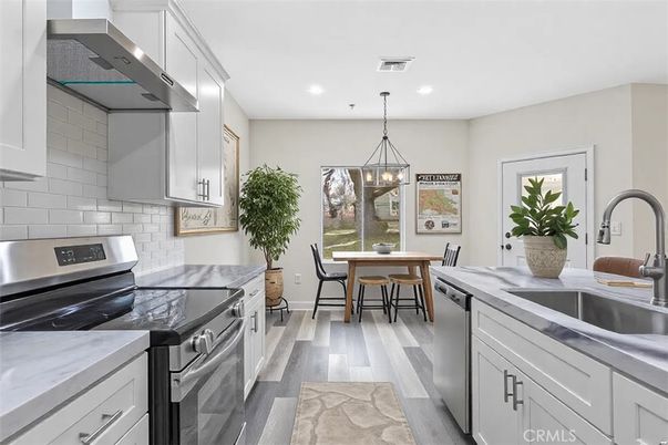 Dining room, Interior, Kitchen, Pendant Lights, Recessed Lighting, Stainless Steel Appliances, Wood Texture Flooring