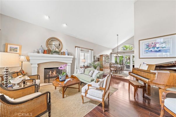 Chandelier, Dining room, Fireplace, Interior, Living room, Piano, Recessed Lighting, Wood Texture Flooring