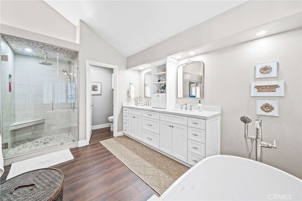 Bathroom, Dual Sink Vanities, Free Standing Baths, Glass Shower, Interior, Recessed Lighting, Wood Texture Flooring