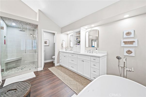 Bathroom, Dual Sink Vanities, Free Standing Baths, Glass Shower, Interior, Recessed Lighting, Wood Texture Flooring