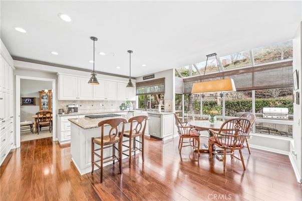 Dining room, Interior, Kitchen, Pendant Lights, Recessed Lighting, Stainless Steel Appliances, Wood Texture Flooring