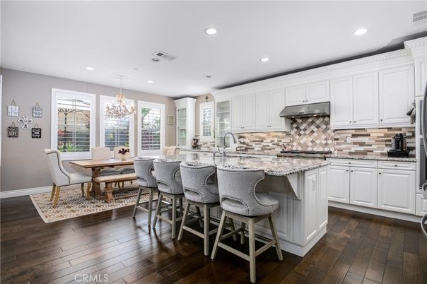 Chandelier, Dining room, Interior, Kitchen, Recessed Lighting, Stainless Steel Appliances, Wood Texture Flooring