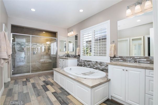 Bathroom, Dual Sink Vanities, Glass Shower, Interior, Recessed Lighting, Wood Texture Flooring