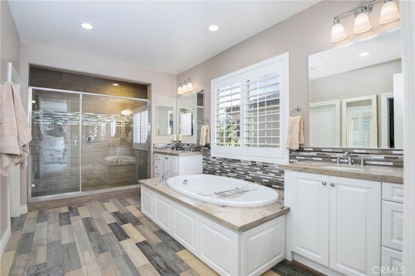 Bathroom, Dual Sink Vanities, Glass Shower, Interior, Recessed Lighting, Wood Texture Flooring