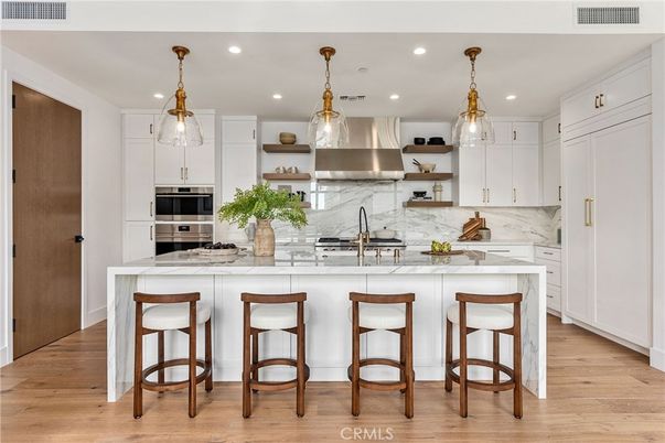 Interior, Kitchen, Marble Walls, Pendant Lights, Recessed Lighting, Stainless Steel Appliances, Wood Texture Flooring