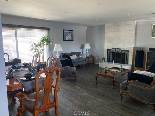 Dining room, Fireplace, Interior, Living room, Recessed Lighting, Stone Walls, Wood Texture Flooring