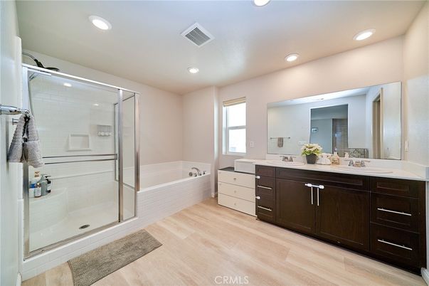 Bathroom, Dual Sink Vanities, Glass Shower, Interior, Recessed Lighting, Wood Texture Flooring