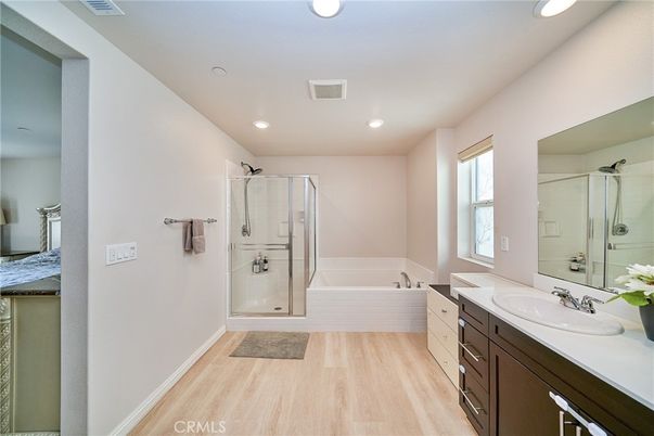 Bathroom, Dual Sink Vanities, Glass Shower, Interior, Recessed Lighting, Wood Texture Flooring
