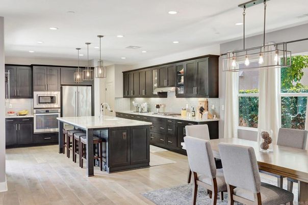 Dining room, Interior, Kitchen, Pendant Lights, Recessed Lighting, Stainless Steel Appliances, Wood Texture Flooring