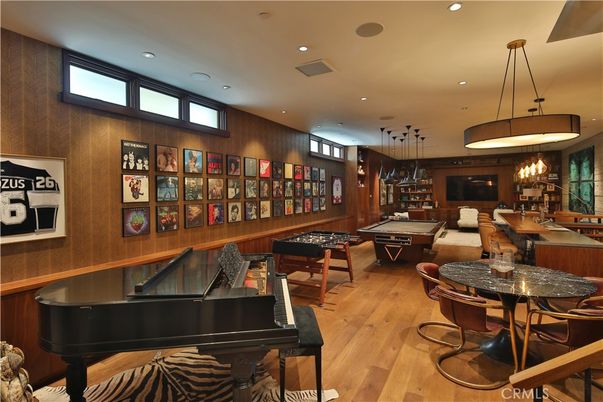 Billiard Table, Dining room, Game Room, Interior, Living room, Pendant Lights, Piano, Recessed Lighting, Wood Texture Flooring, Wooden Walls