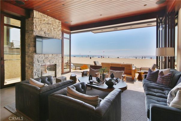 Fireplace, Interior, Living room, Recessed Lighting, Stone Walls, Water, Wooden Ceilings