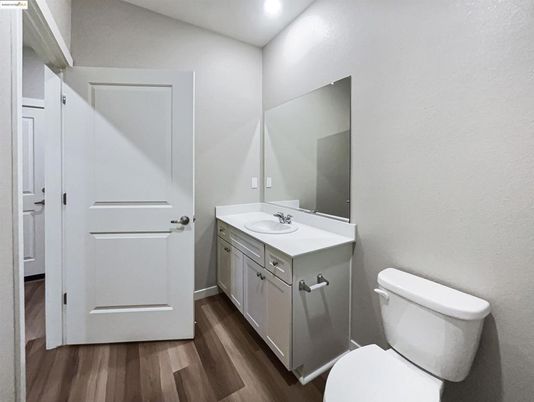 Bathroom, Dual Sink Vanities, Interior, Recessed Lighting, Wood Texture Flooring