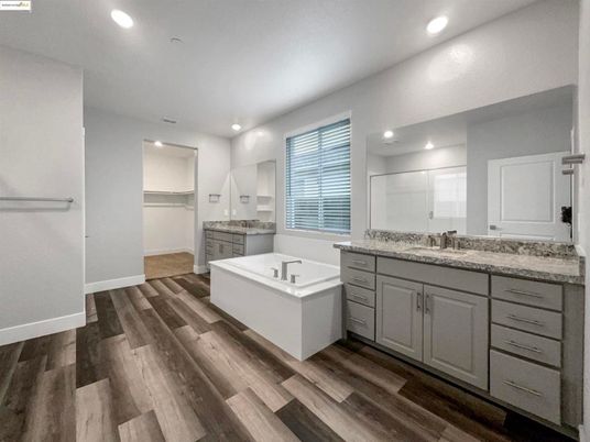 Bathroom, Dual Sink Vanities, Free Standing Baths, Interior, Recessed Lighting, Wood Texture Flooring