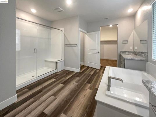 Bathroom, Dual Sink Vanities, Glass Shower, Interior, Recessed Lighting, Wood Texture Flooring