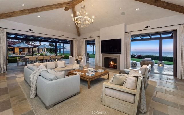 Chandelier, Dining room, Fireplace, Interior, Living room, Recessed Lighting, Water, Wooden Beams