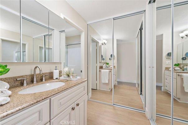 Bathroom, Dual Sink Vanities, Interior, Washer, Wood Texture Flooring