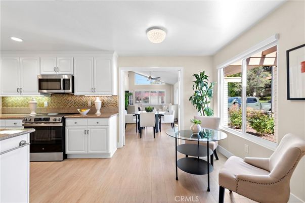 Dining room, Interior, Kitchen, Recessed Lighting, Stainless Steel Appliances, Wood Texture Flooring