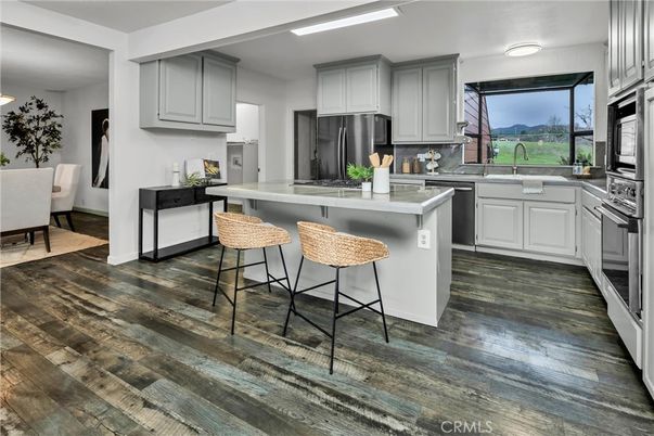 Dining room, Interior, Kitchen, Recessed Lighting, Stainless Steel Appliances, Wood Texture Flooring