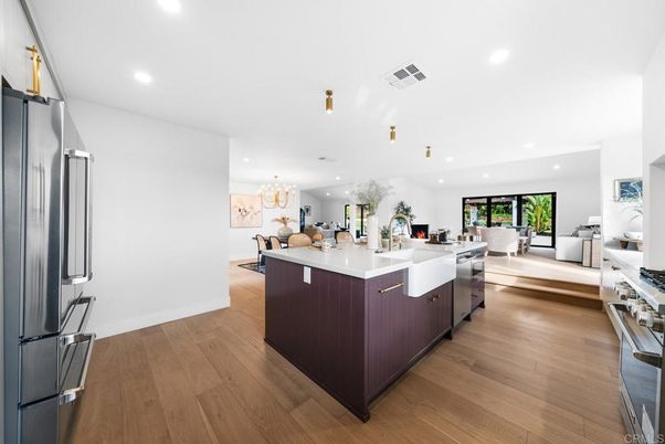 Chandelier, Dining room, Interior, Kitchen, Living room, Pendant Lights, Recessed Lighting, Stainless Steel Appliances, Wood Texture Flooring