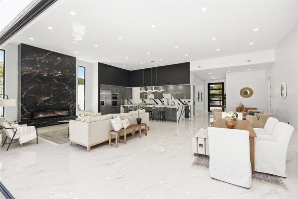 Dining room, Fireplace, Interior, Kitchen, Living room, Marble, Marble Walls, Pendant Lights, Recessed Lighting, Stainless Steel Appliances