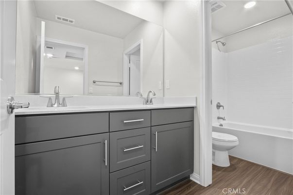 Bathroom, Dual Sink Vanities, Interior, Recessed Lighting, Wood Texture Flooring