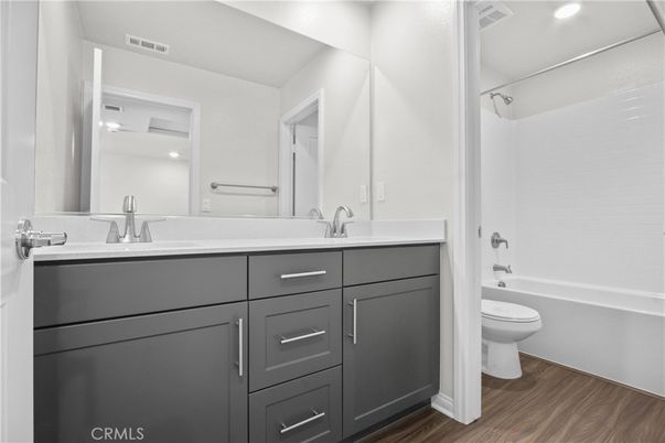 Bathroom, Dual Sink Vanities, Interior, Recessed Lighting, Wood Texture Flooring