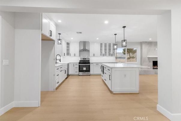 Fireplace, Interior, Kitchen, Pendant Lights, Recessed Lighting, Stainless Steel Appliances, Wood Texture Flooring