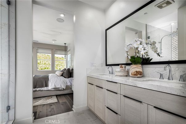 Bathroom, Bedroom, Dual Sink Vanities, Glass Shower, Interior, Marble, Marble Walls, Recessed Lighting, Wood Texture Flooring