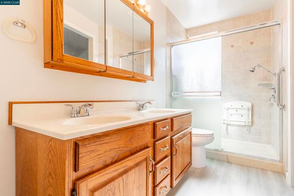 Bathroom, Dual Sink Vanities, Glass Shower, Interior, Wood Texture Flooring