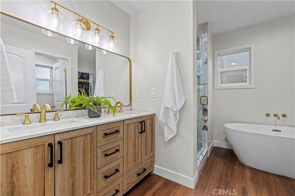 Bathroom, Dual Sink Vanities, Free Standing Baths, Glass Shower, Interior, Wood Texture Flooring