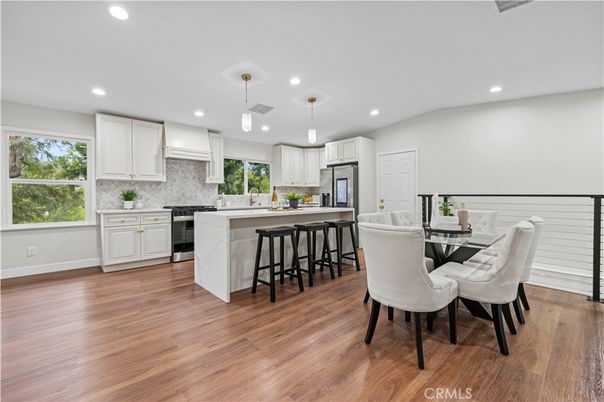Dining room, Interior, Kitchen, Pendant Lights, Recessed Lighting, Stainless Steel Appliances, Wood Texture Flooring