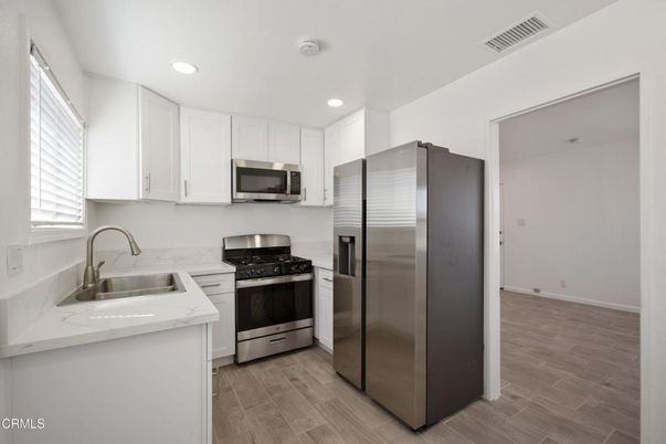Interior, Kitchen, Recessed Lighting, Stainless Steel Appliances, Wood Texture Flooring