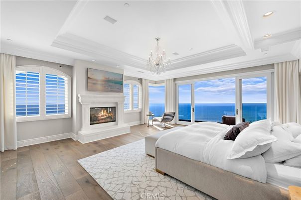 Bedroom, Chandelier, Fireplace, Interior, Recessed Lighting, Water, Wood Texture Flooring