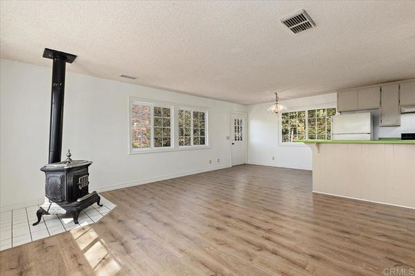 Chandelier, Empty room, Fireplace, Interior, Pendant Lights, Wood Texture Flooring