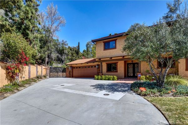 Attached, Backyard, Exterior, Facade, Brick Facade, Mediterranean