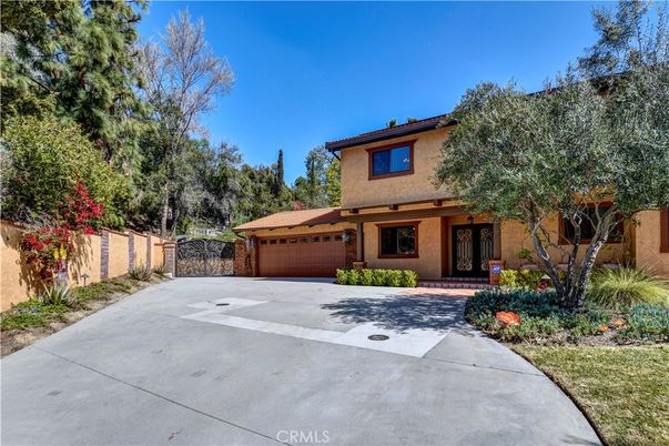 Attached, Backyard, Exterior, Facade, Brick Facade, Mediterranean