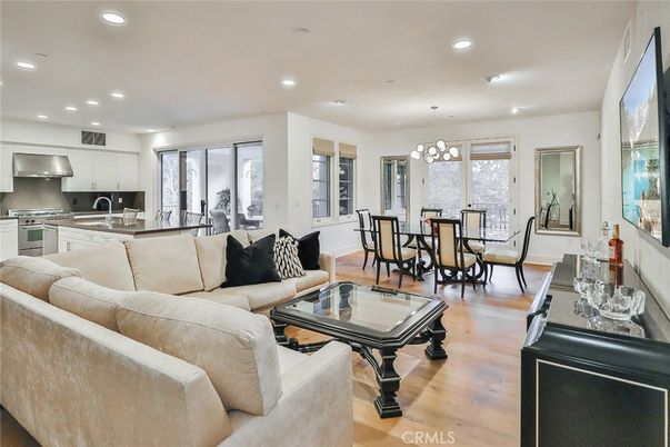 Chandelier, Dining room, Interior, Kitchen, Living room, Pendant Lights, Recessed Lighting, Stainless Steel Appliances, Wood Texture Flooring