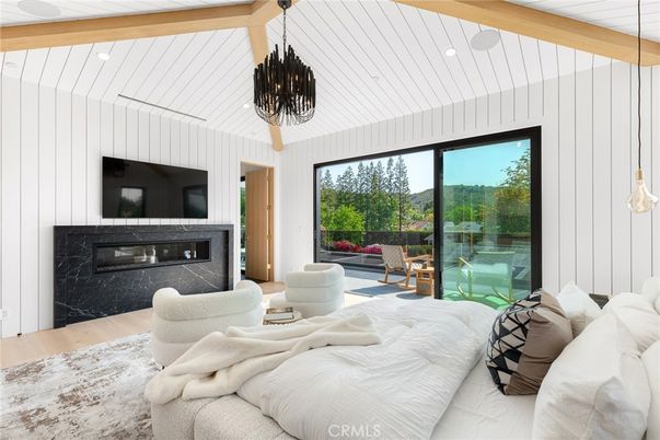 Bedroom, Chandelier, Fireplace, Interior, Living room, Pendant Lights, Recessed Lighting, Wooden Beams, Wood Texture Flooring