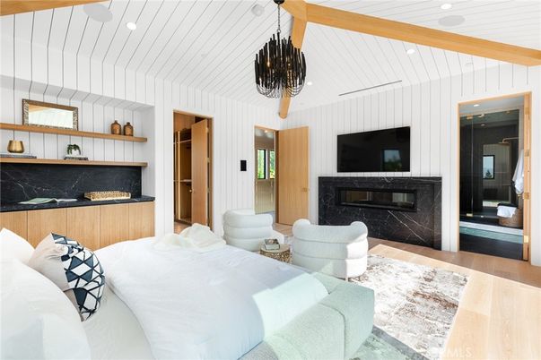 Bedroom, Chandelier, Fireplace, Interior, Living room, Recessed Lighting, Wood Texture Flooring