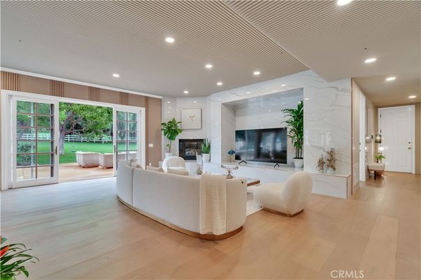 Fireplace, Interior, Living room, Marble Walls, Recessed Lighting, Wood Texture Flooring