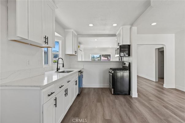 Interior, Kitchen, Recessed Lighting, Washer, Wood Texture Flooring