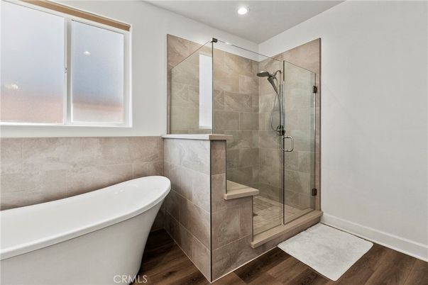 Bathroom, Free Standing Baths, Glass Shower, Interior, Recessed Lighting, Wood Texture Flooring