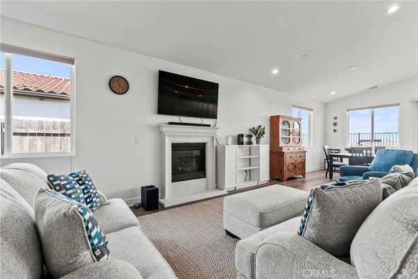 Dining room, Fireplace, Interior, Living room, Recessed Lighting, Wood Texture Flooring