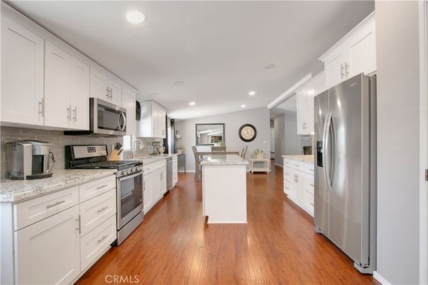 Dining room, Interior, Kitchen, Recessed Lighting, Stainless Steel Appliances, Wood Texture Flooring