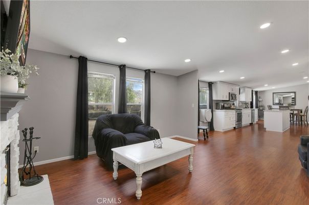 Dining room, Fireplace, Interior, Kitchen, Recessed Lighting, Wood Texture Flooring