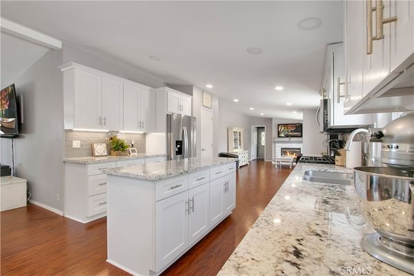Fireplace, Interior, Kitchen, Recessed Lighting, Stainless Steel Appliances, Wood Texture Flooring