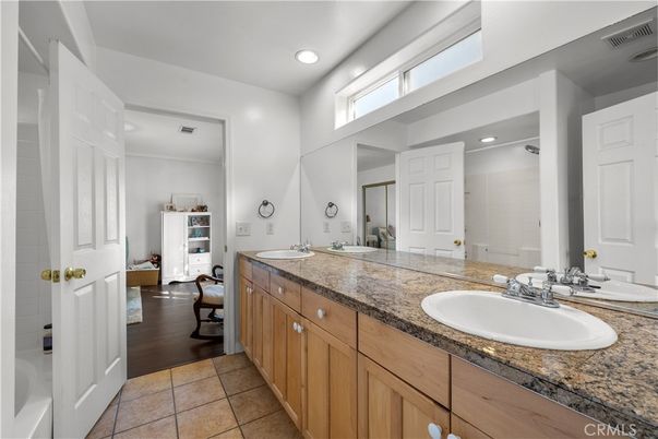 Bathroom, Dual Sink Vanities, Interior, Recessed Lighting, Wood Texture Flooring